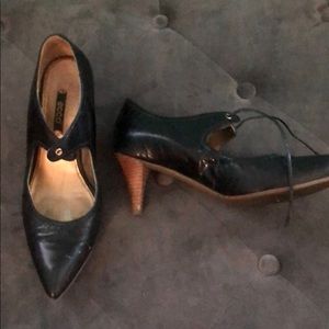 Black leather point toe shoes